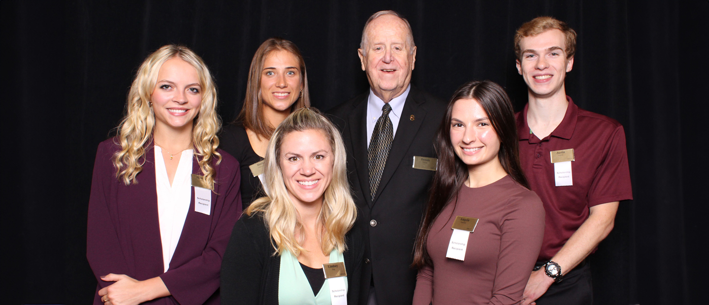 Group photo of Dennis Pawley and 5 scholarship recipients