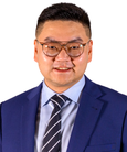 Liang Zhao smiling at the camera