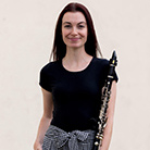 Erin Dowler, holding a clarinet