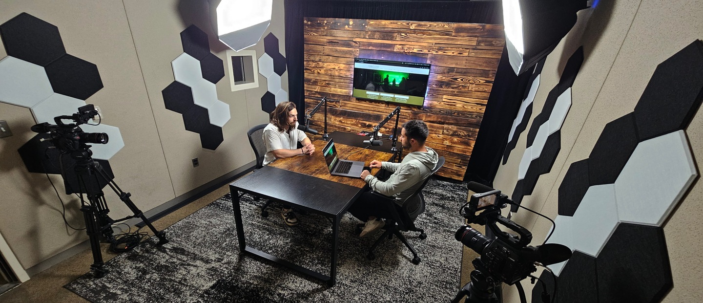 Podcast Studio Two people talking in podcast studio
