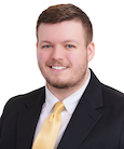 A headshot of Austin Strong