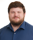 A headshot of Joshua Corbett