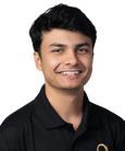 Vandit Sukhadiya smiling at the camera