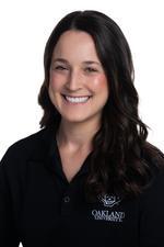 A professional headshot of Erika LeDonne in a black Oakland University shirt.