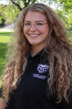 A headshot of Lauren Roy outdoors.