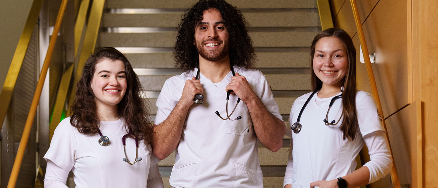 students wearing white lab coats